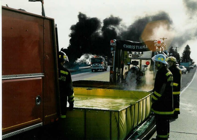 Tanker 4-9 assisting the Sadsburyville Fire Co. at a gasoline tanker fire; Business Route 30 at the Route 30 bypass... 3/15/92